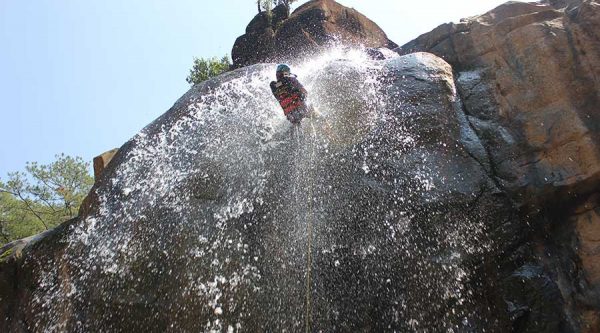 abseiling at a waterfall in Dalat at canyoning tour