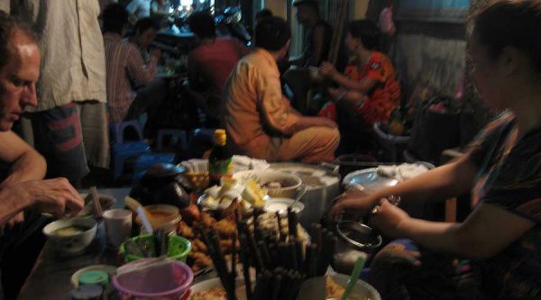eating street food in Hanoi