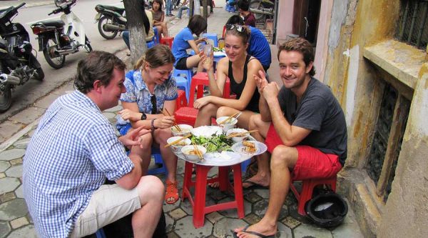 Group tourist at street food tour in Hanoi