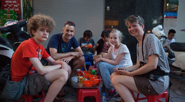 kids at a street food tour in Hanoi
